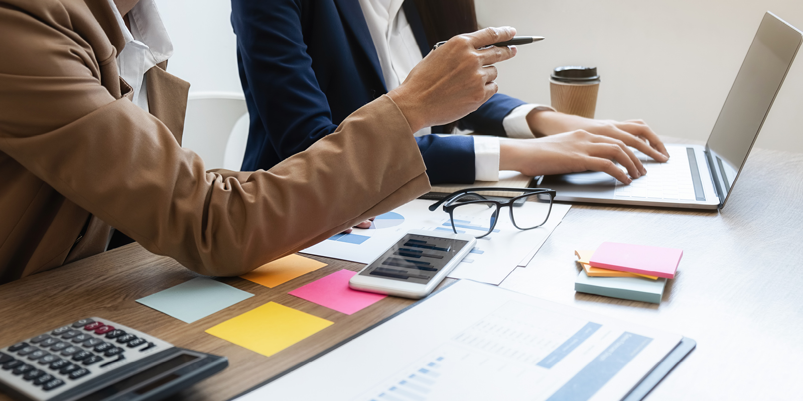 Advisors reviewing employee benefits strategy and renewal options