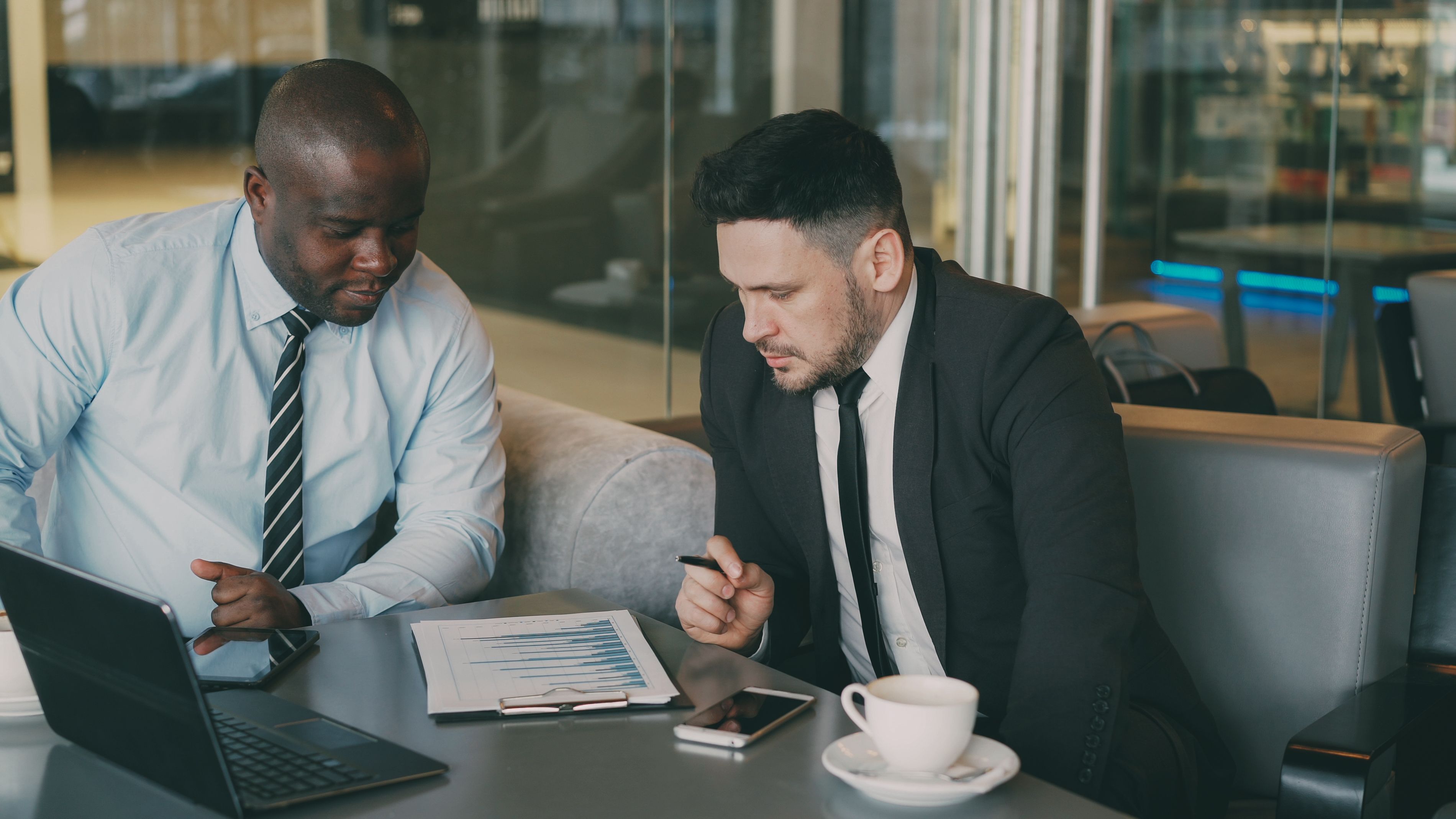 Business professionals reviewing financial reports together