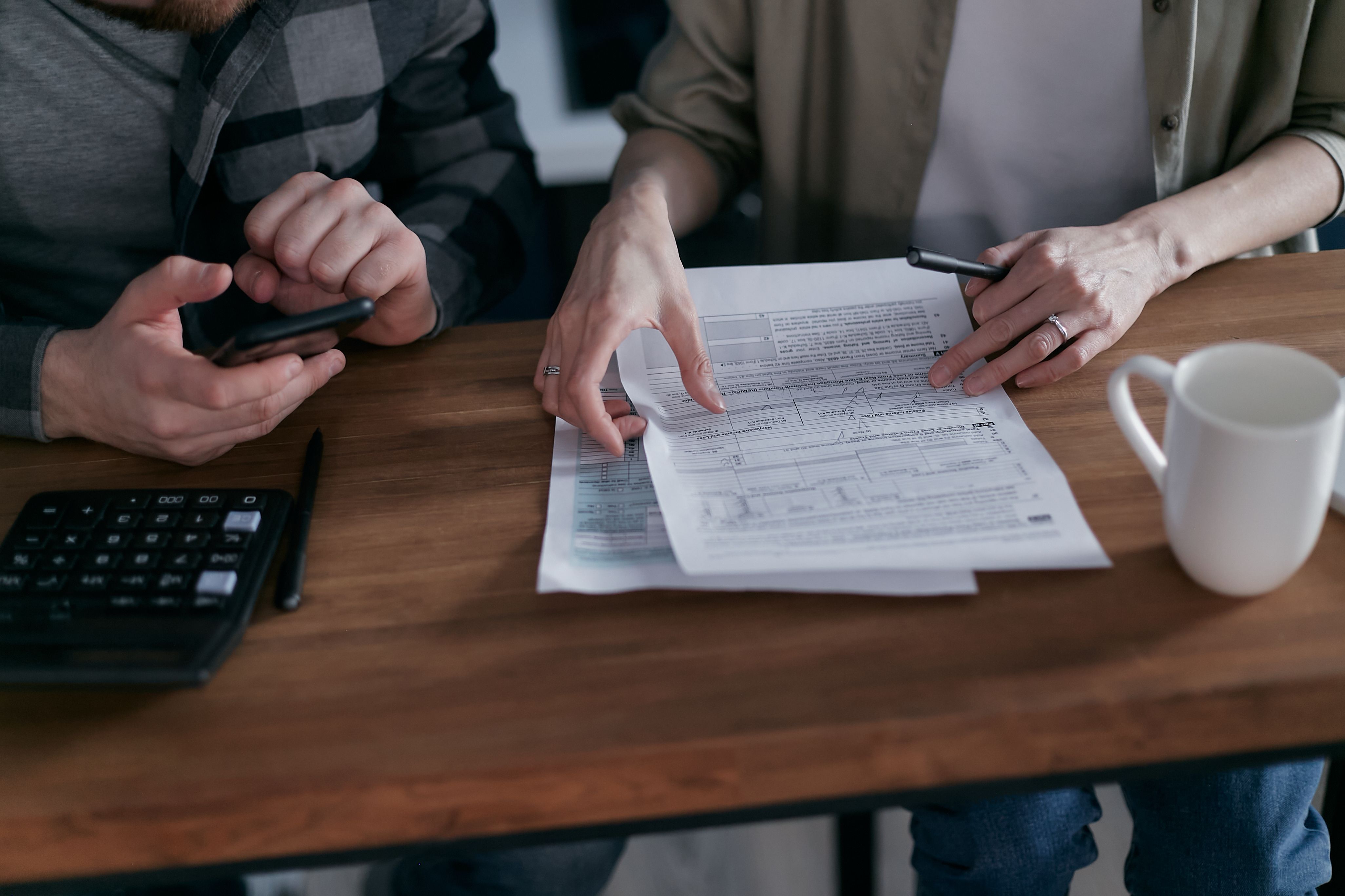 Professionals reviewing life insurance policy documents