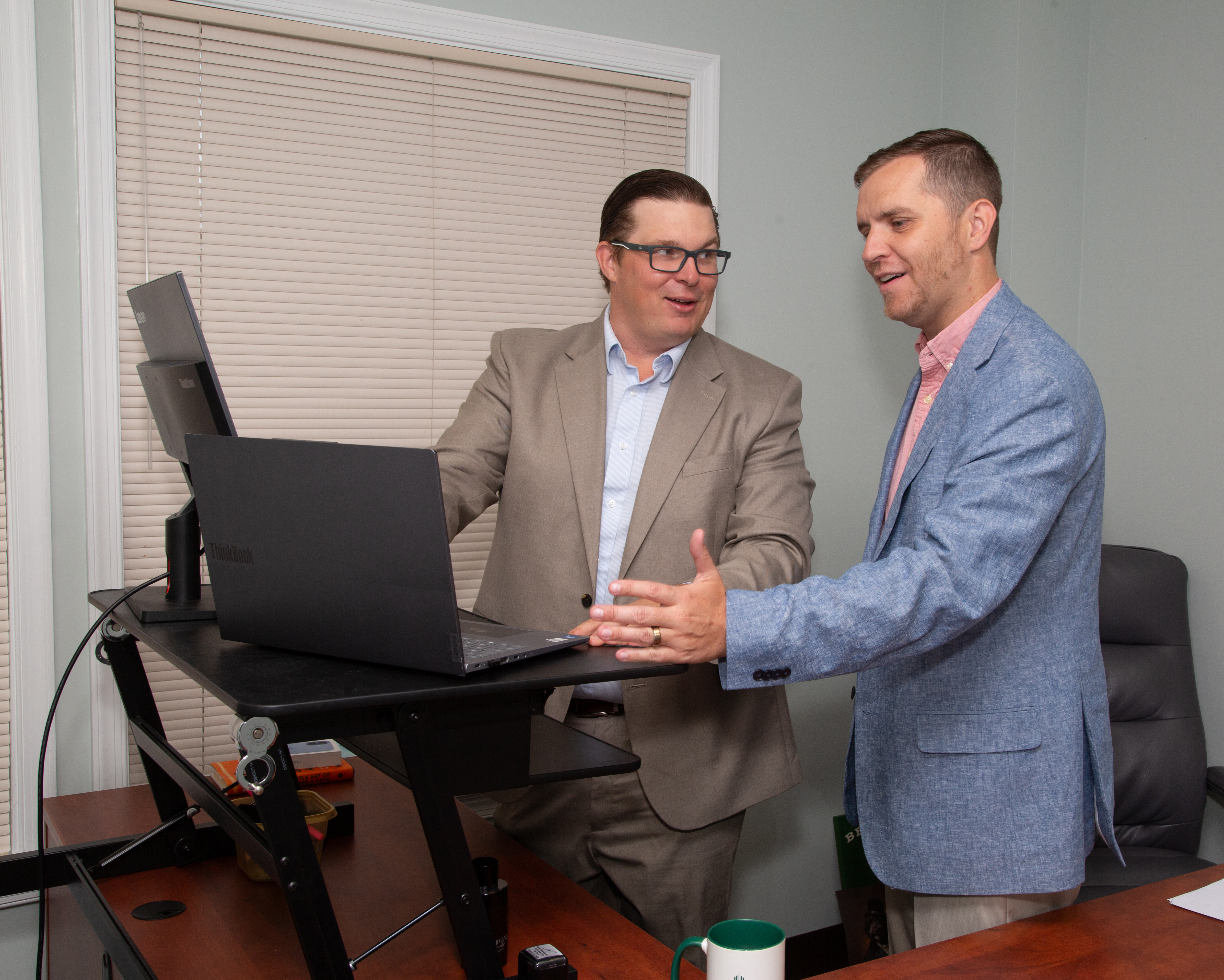 Nester Insurance team members discussing a client's benefits strategy